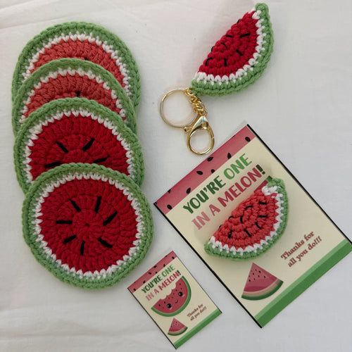 Handcrafted crochet watermelon coaster and matching keychain in red, green, white, and black cotton yarn with classic watermelon slice design
